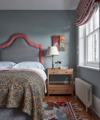 Gray bedroom with upholstered headboard