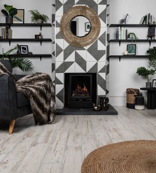 black and white modern tiles on chimney breast with shelves either side
