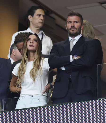 An image of Victoria Beckham wearing a white t-shirt and jeans to the 2026 World Cup semi-final England vs Argentina match.