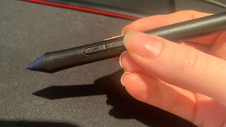 The stylus for the One by Wacom held in hand