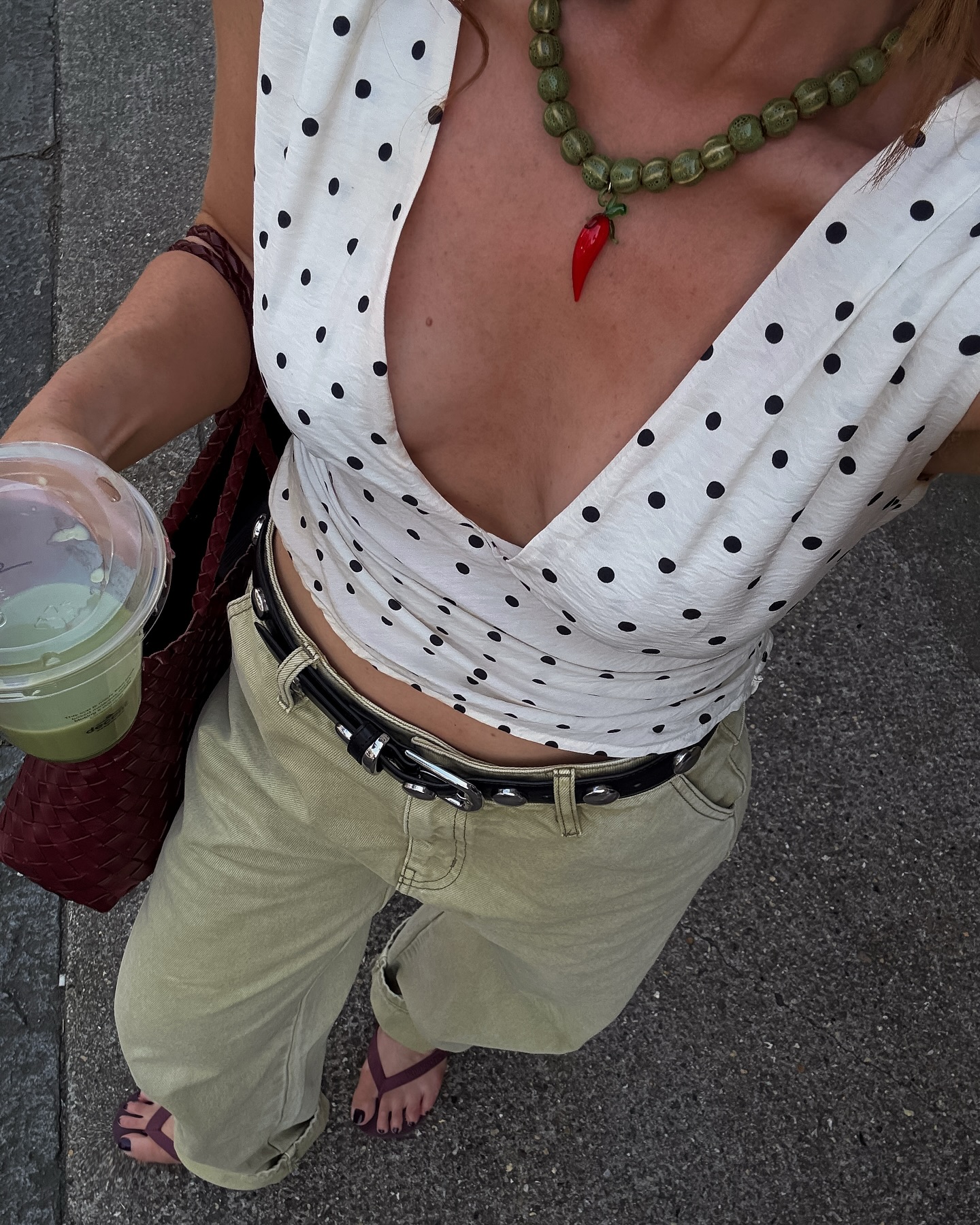 @rebeccaferrazwyatt's image wearing a polka dot top, one of the key summer trends in 2025.