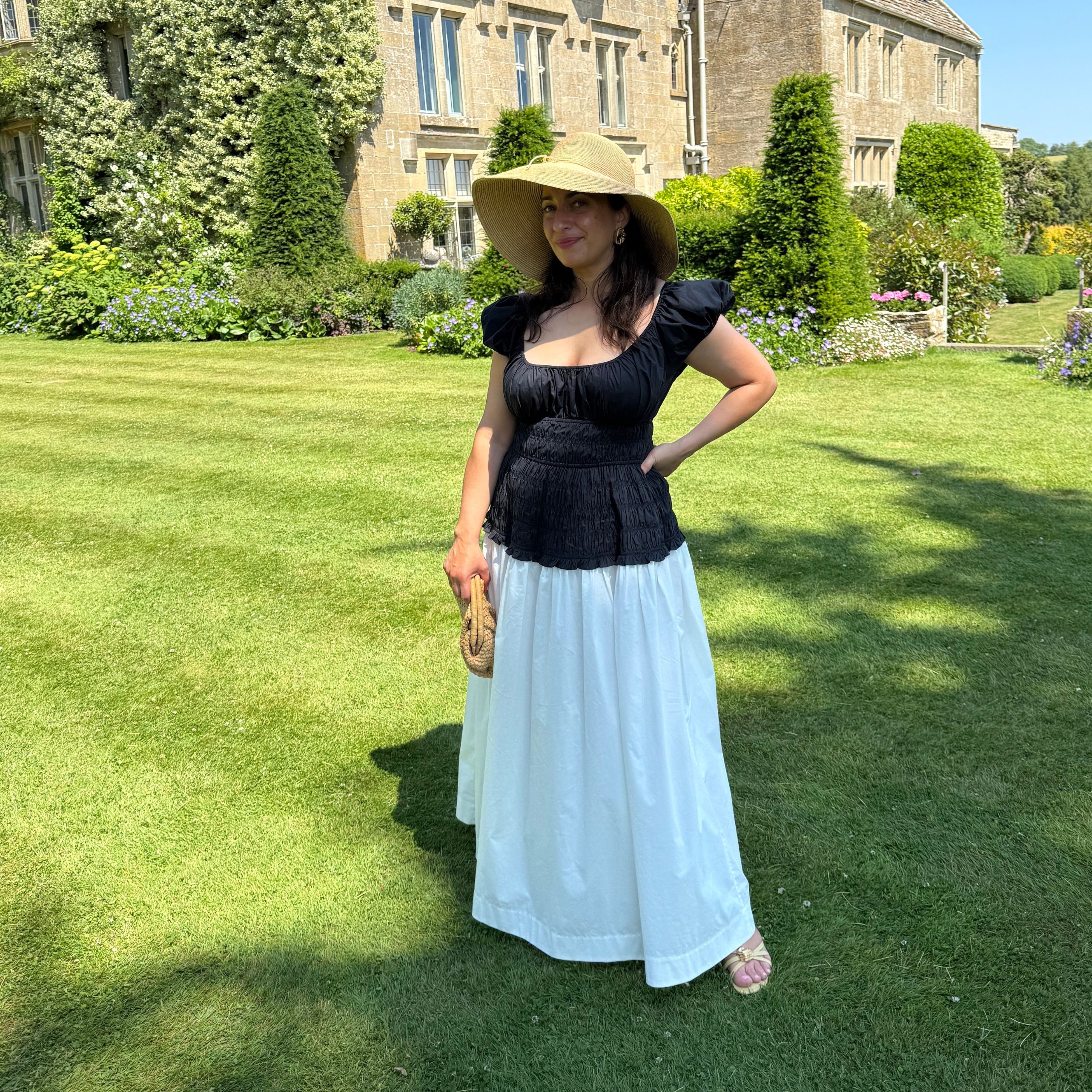 woman wearing a monochrome shirred dress