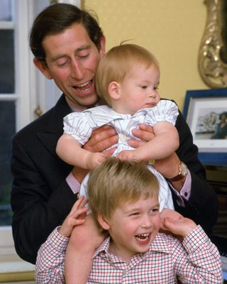 King Charles poses for a photo with his two sons