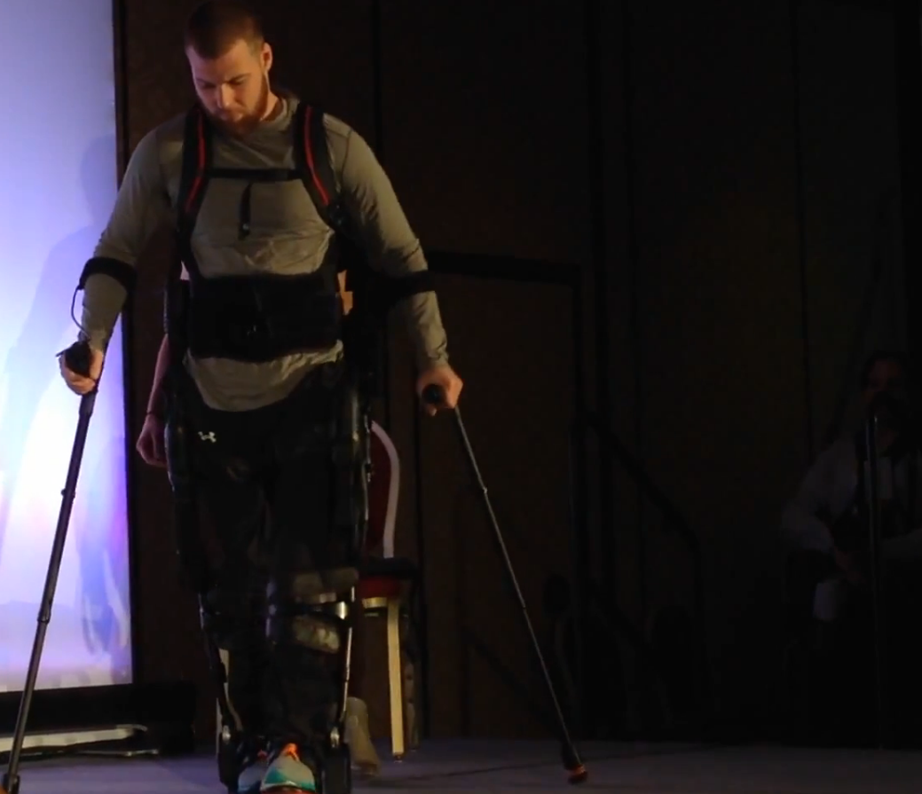 Shane Mosko demonstrates how a new device helps him to walk, at CES 2015.