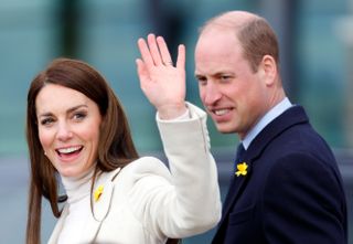 Prince William and Kate Middleton at an engagement, Kate waving to crowds