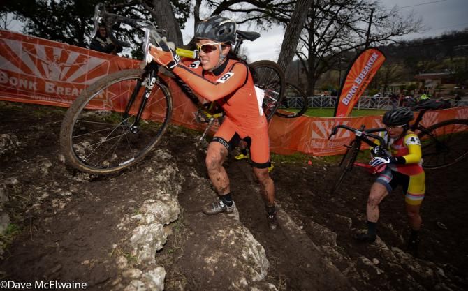Katie Compton (Trek Factory Racing) finishes off a set of stairs with a massive race lead