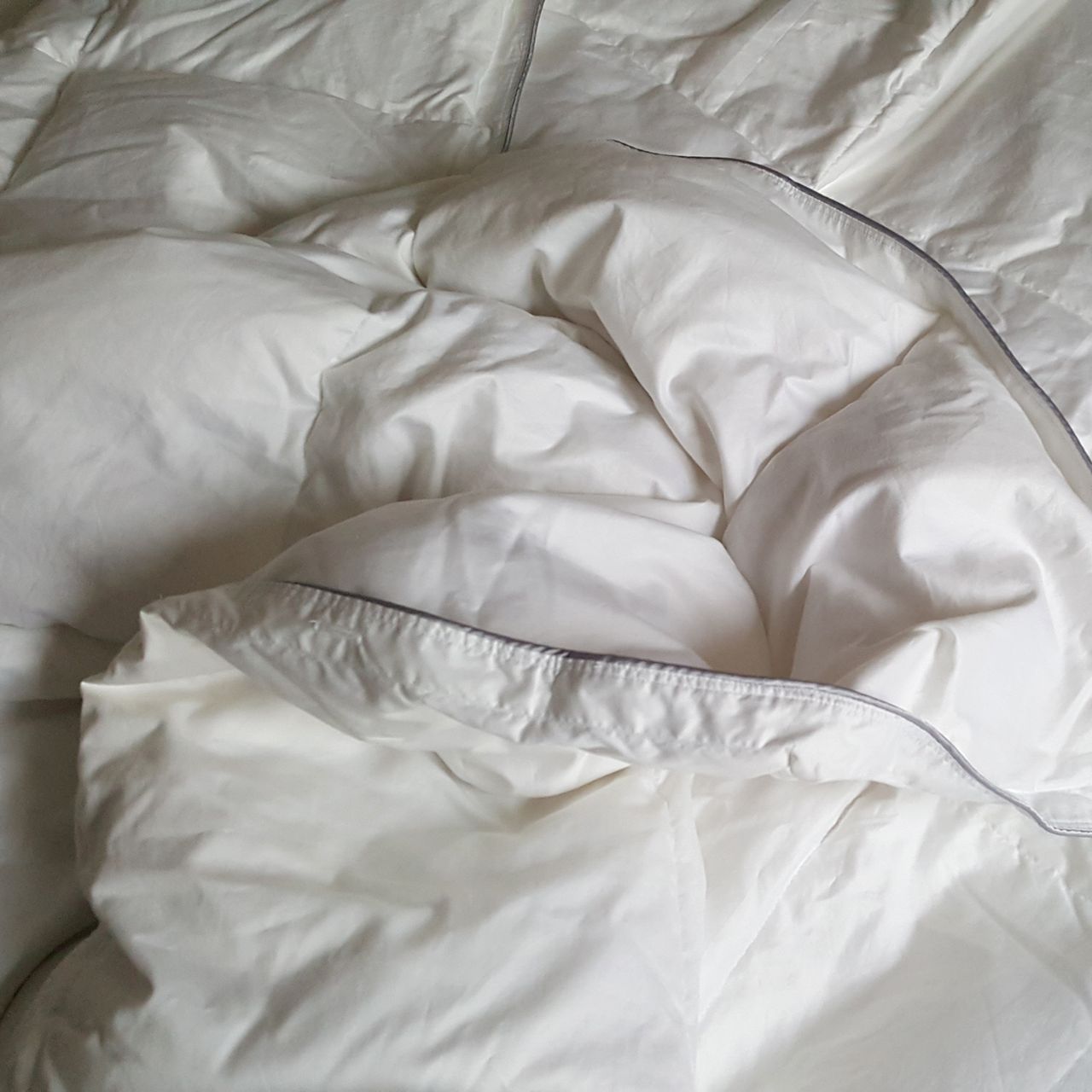 The scooms All-Season Hungarian Goose Down Duvet on a bed being tested