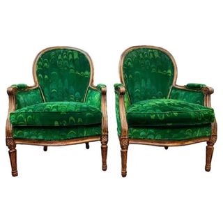 upholstered chairs in green on white background