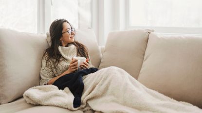 woman relaxing on sofa