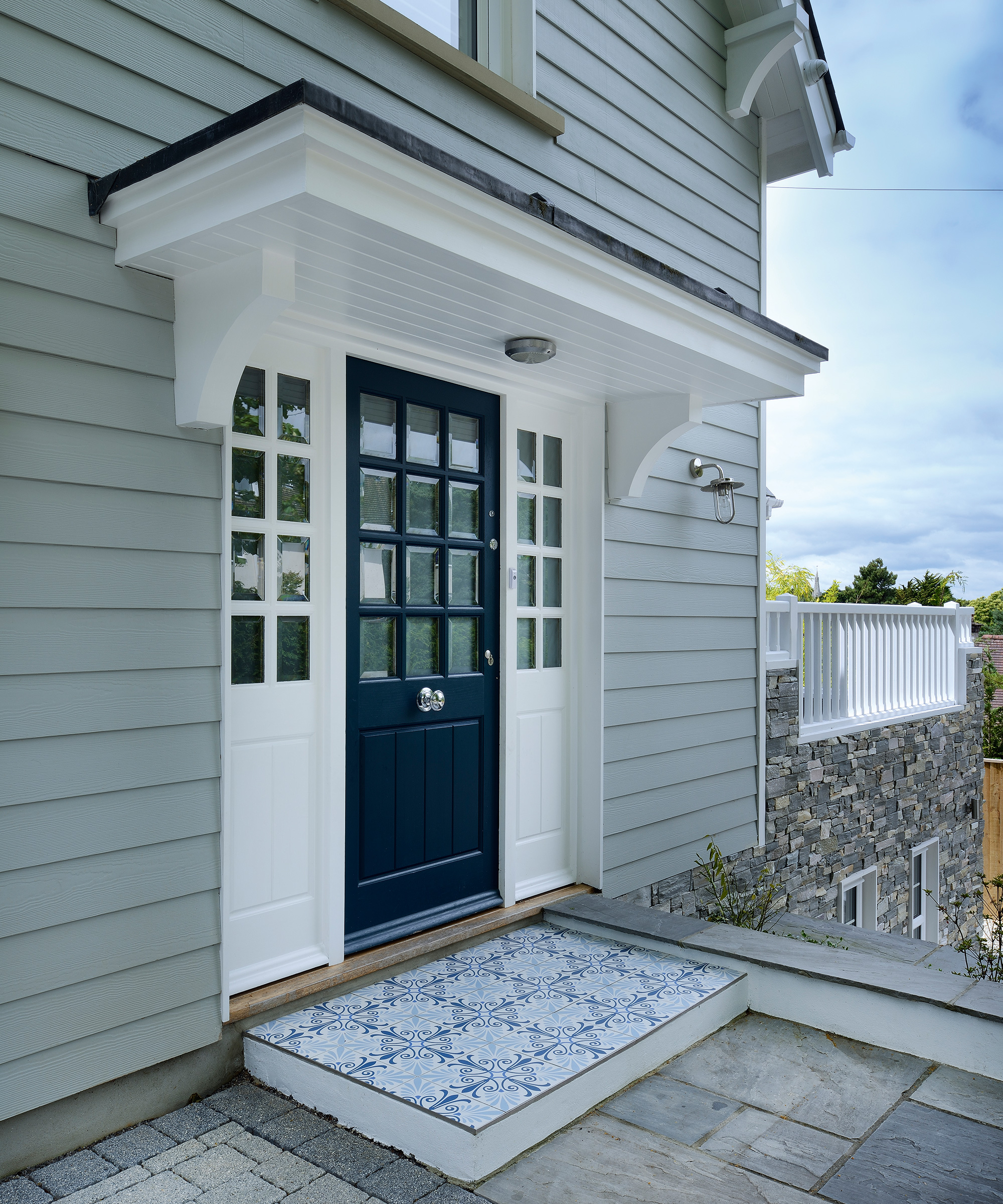 New England style home with small white porch