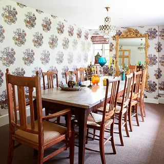 dining room with wallpaper wall and dining table and chair