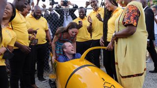 Prince William, Duke of Cambridge and Catherine, Duchess of Cambridge meet The Jamaica National bobsleigh team during a visit to Trench Town, the birthplace of reggae music, on day four of the Platinum Jubilee Royal Tour of the Caribbean on March 22, 2022 in Kingston, Jamaica.