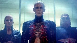 Doug Bradley as Pinhead, Grace Kirby as Female Cenobite, and Simon Bamford as Butterball in the horror movie, Hellraiser.