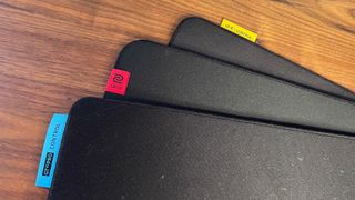 A Razer Goliathus V2 Pro Control, Zowie H-SR III, and Steelseries QcK Performance Control mouse pad, layered on a desk.