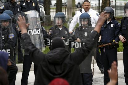 Baltimore police: Seven officers injured in clash with protesters
