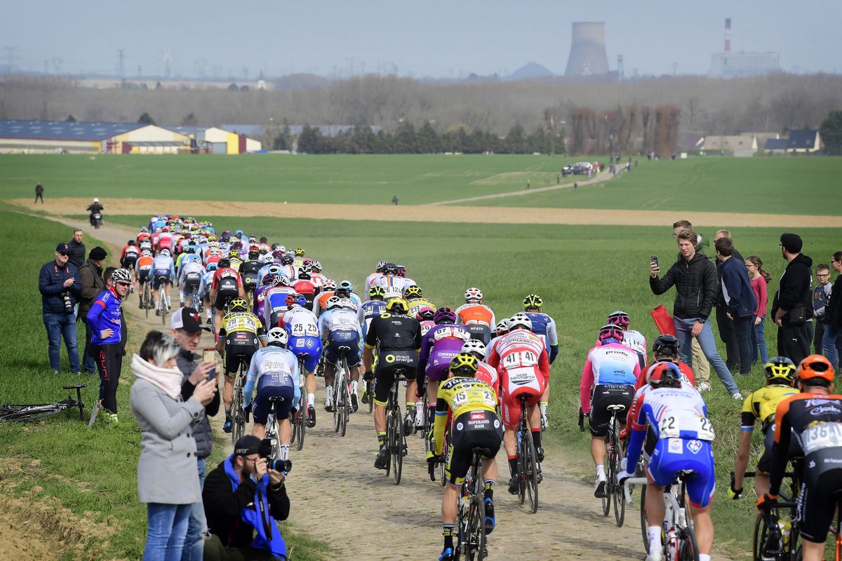 A rear view of the peloton and the cobbles of northern France