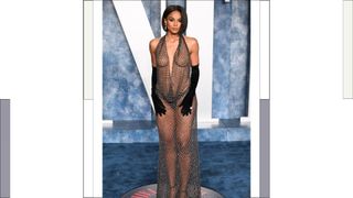 Ciara wears a black sheer dress and long gloves as she attends the 2023 Vanity Fair Oscar Party hosted by Radhika Jones at Wallis Annenberg Center for the Performing Arts on March 12, 2023 in Beverly Hills, California.