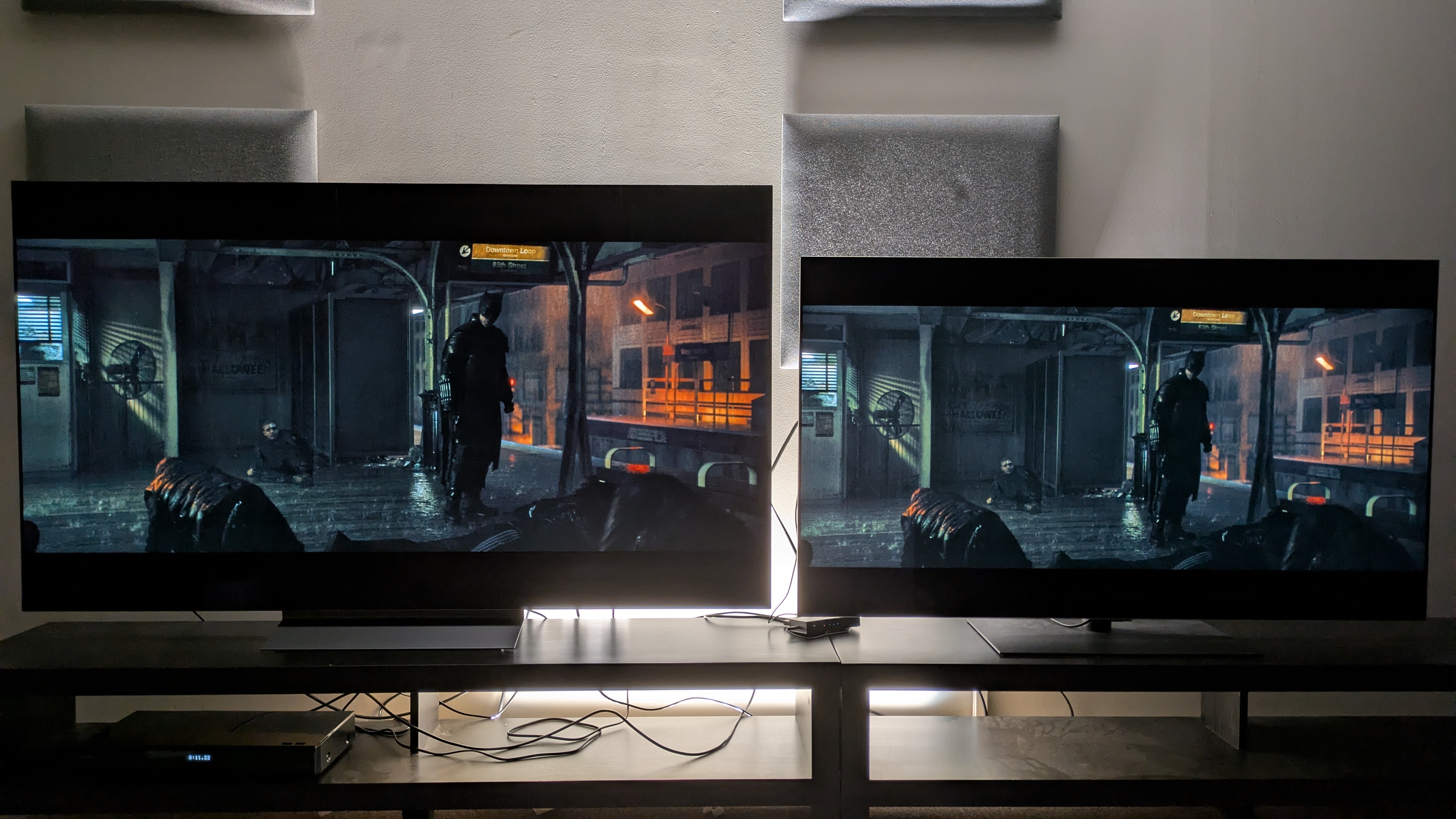 LG C6 (left) and LG G5 (right) with a scene from The Batman on-screen. Both TVs have great contrast, but the C6 looks a bit more natural