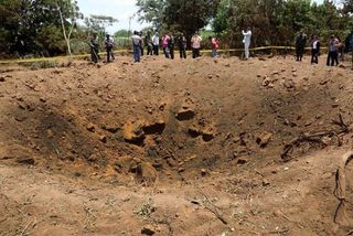 Officials say that a meteorite probably created this 40-foot-wide crater in Nicaragua overnight on Sept. 6, 2014.