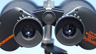 Close-up of the eyepieces on a large pair of Celestron SkyMaster binoculars.