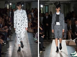 Males models walking the runway wearing white, black and grey patterned suits from the Comme des Garcons Homme SS2015 Collection