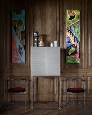 Chairs & cabinets in front of wooden wall