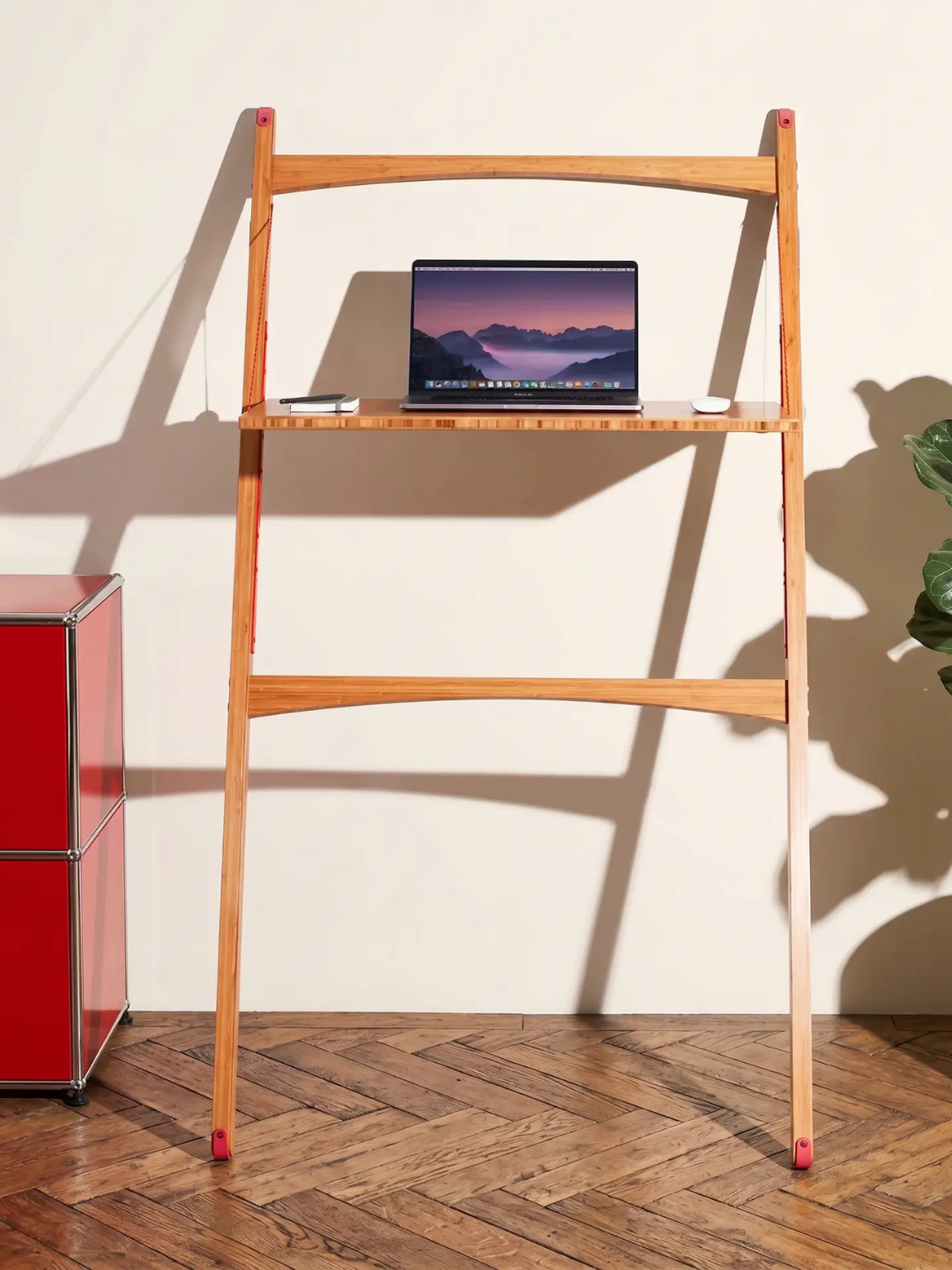 A bamboo folding sit-stand desk from Leandesk
