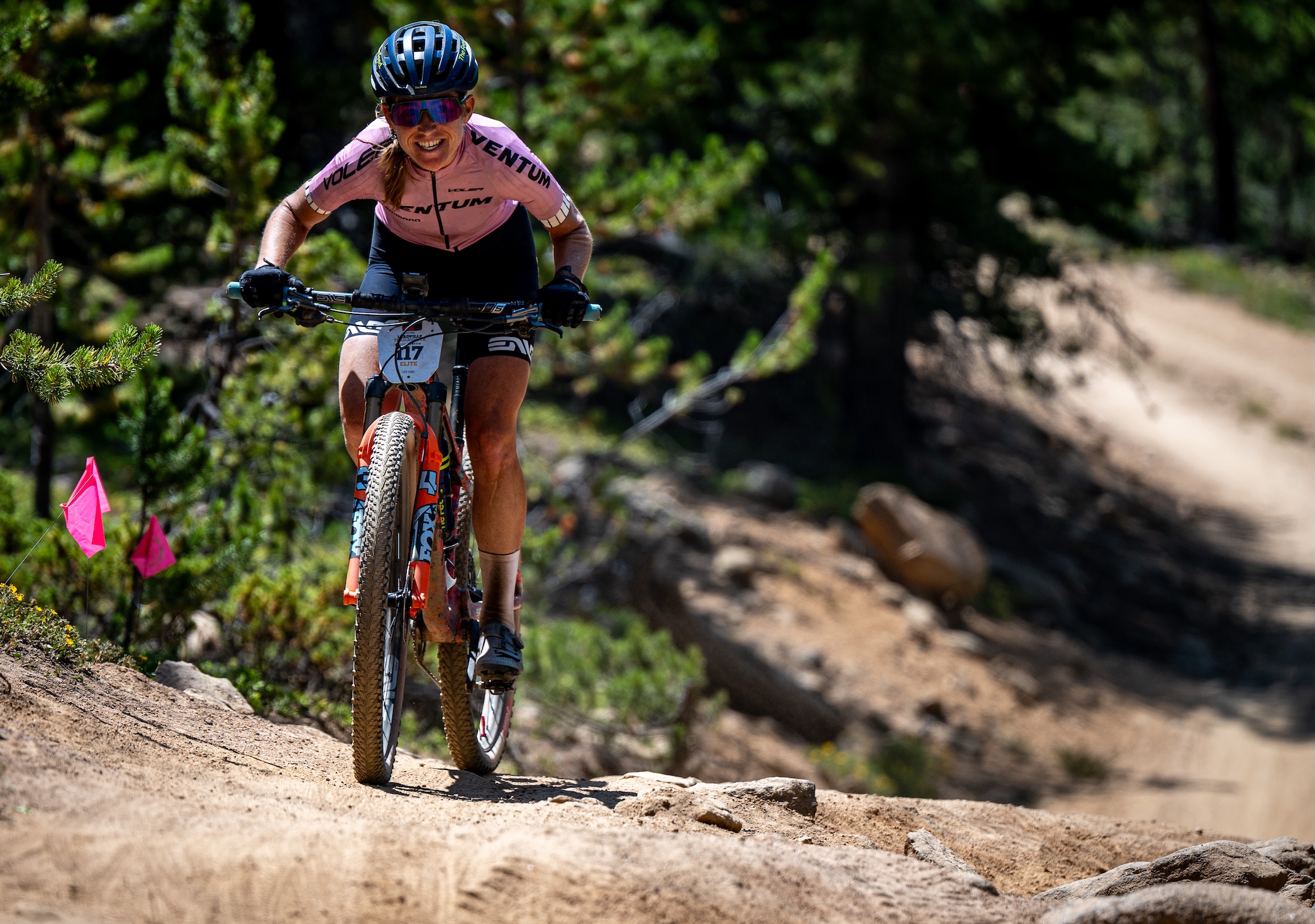 Lauren Stephens (Aegis) rides solo on a climb at 2025 Leadville Trail 100 MTB, where she had the third best time for women but was disqualified for taking an improper feed