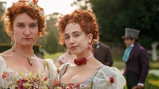 BESSIE CARTER as PRUDENCE FEATHERINGTON and HARRIET CAINS as PHILLIPA FEATHERINGTON in episode 106 of BRIDGERTON
