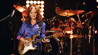 Bonnie Raitt playing her Fender Strat on stage