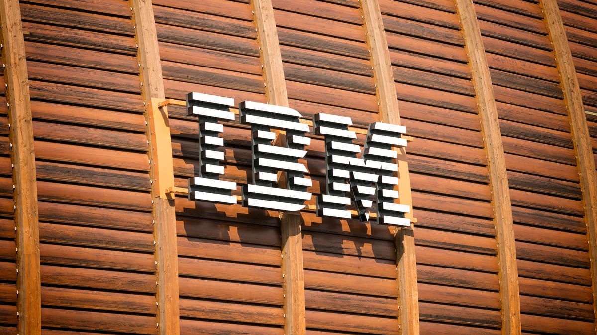 IBM&amp;#039;s logo on the outside of a wood-panelled building