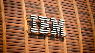 IBM's logo on the outside of a wood-panelled building