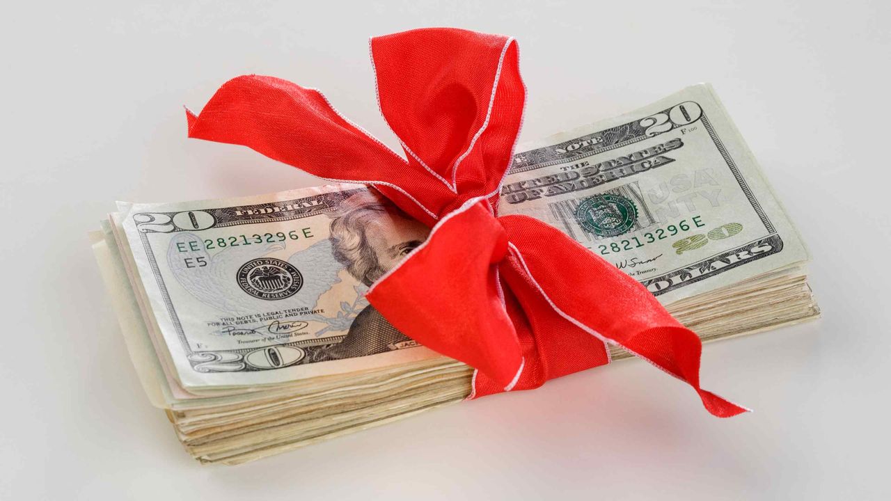 cash with a red bow on it