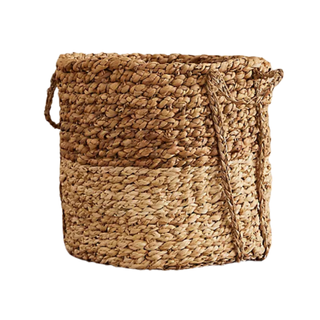 A rattan style woven basket from Anthropologie