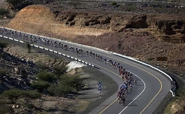 The peloton winds on the roads of Oman.