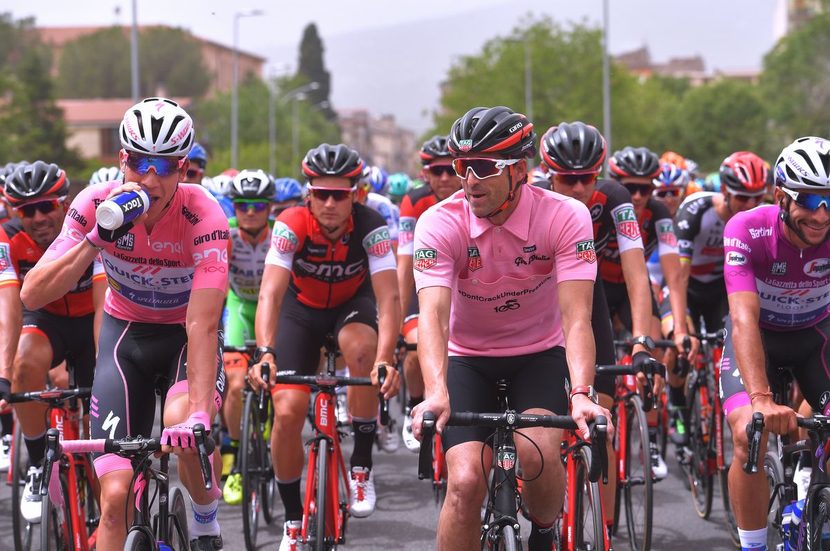 Maglia rosa Bob Jungels rolling along with special guest of the Giro, Patrick Dempsey also in pink