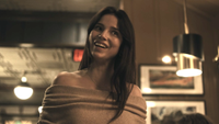 Inde Navarette shaking her head as Nikki at restaurant scene in Obsession