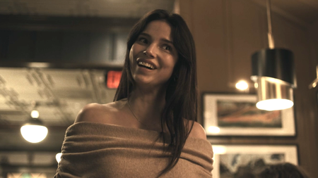 Inde Navarette shaking her head as Nikki at restaurant scene in Obsession