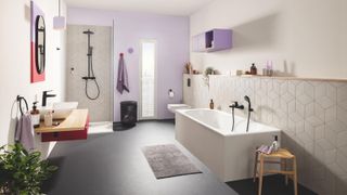 modern bathroom with purple walls and back to wall bath