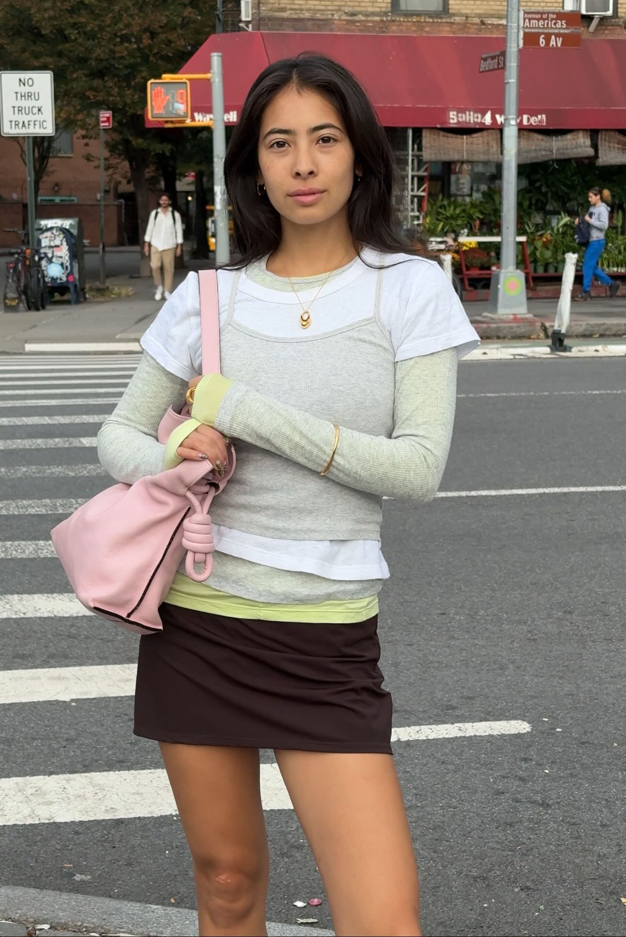 Woman in layered tank tops and tees.