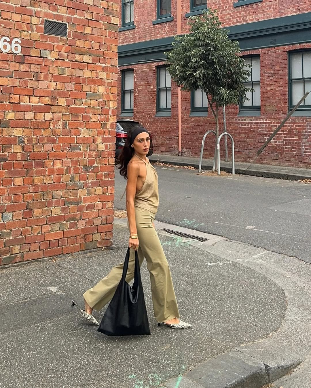 Woman wearing camel colored clothing summer 2025