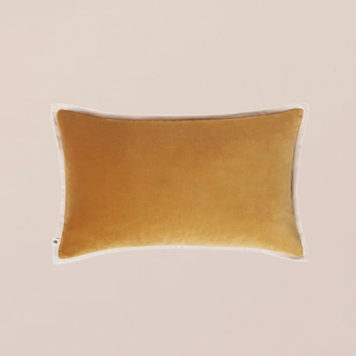 A tangerine throw pillow