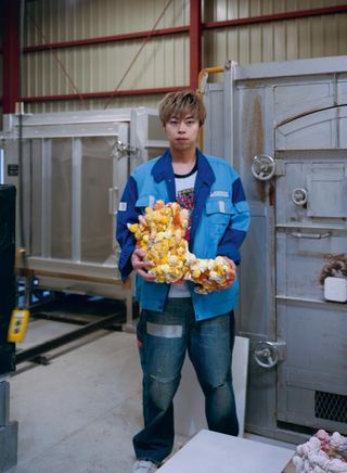 Top: Kazuhito Kawai photographed by Takashi Homma in the artist's Kasama studio. He is holding a collapsed ceramic piece. Above: a ceramic work in progress