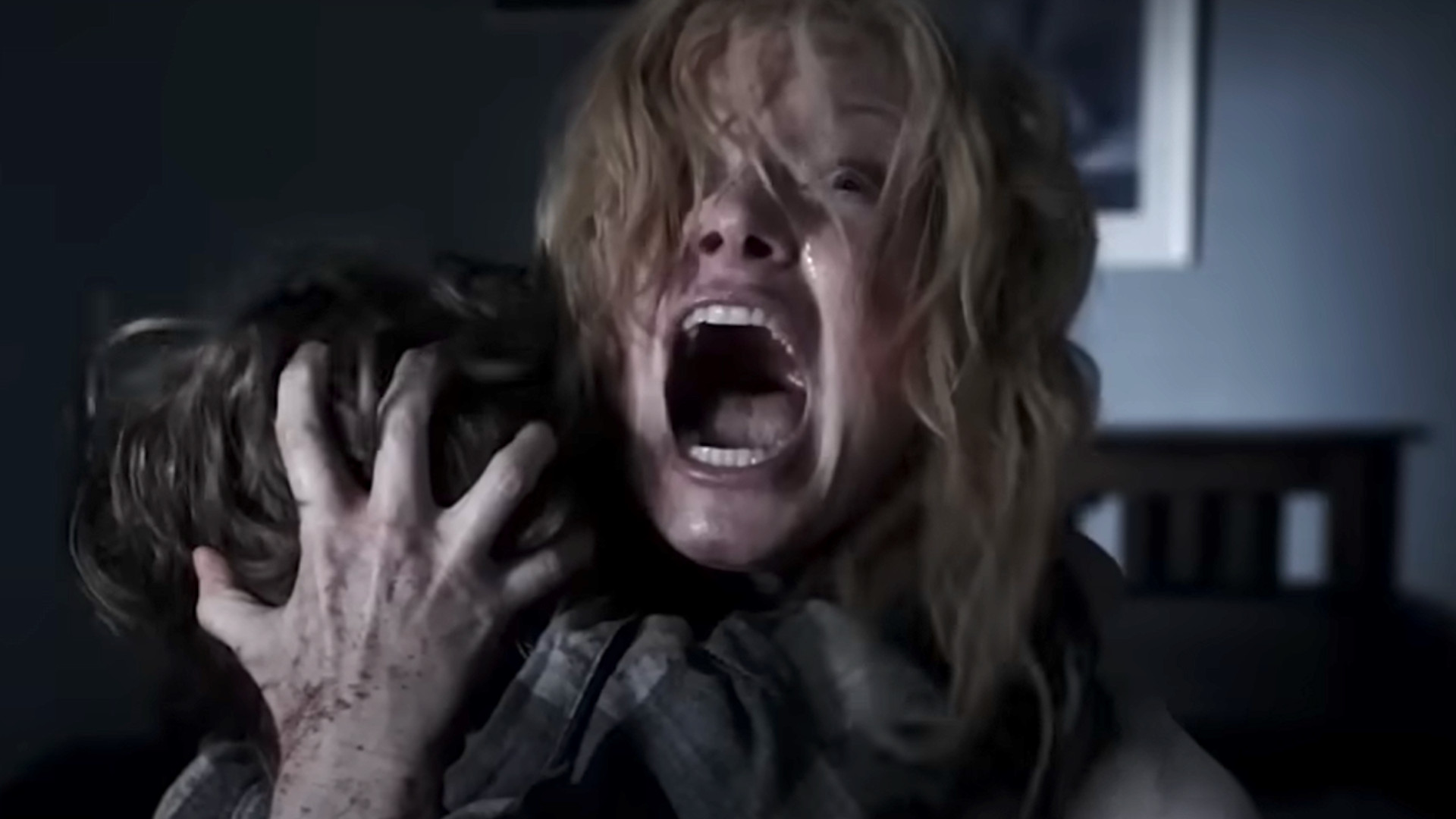 Essie Davis as Amelia Vanek screaming during the horror movie, The Babadook.