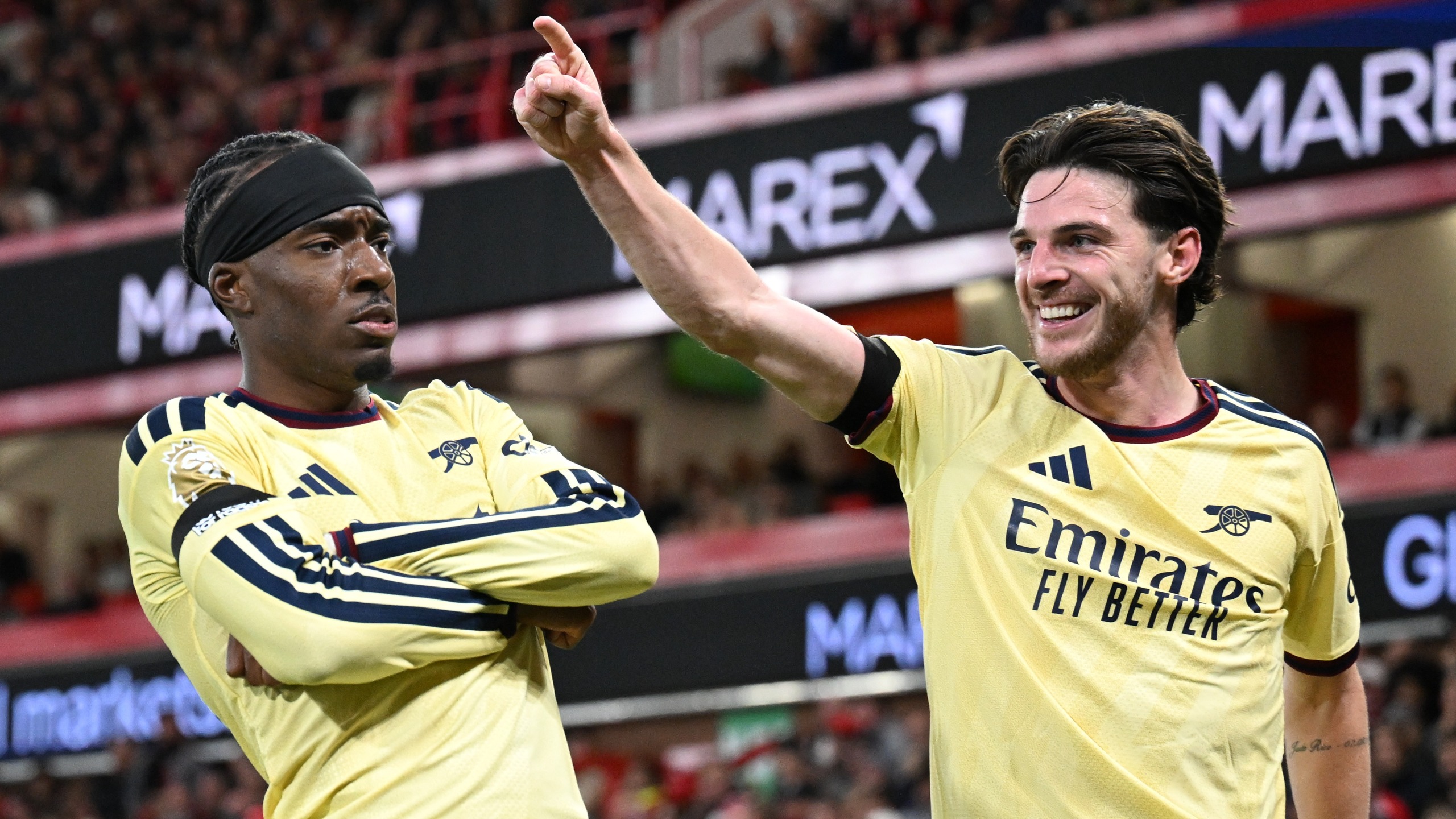 Noni Madueke of Arsenal celebrates scoring the winning goal with Declan Rice in the Premier League 2026/27 match against Nottingham Forest FC at City Ground on October 18, 2026 in Nottingham, England