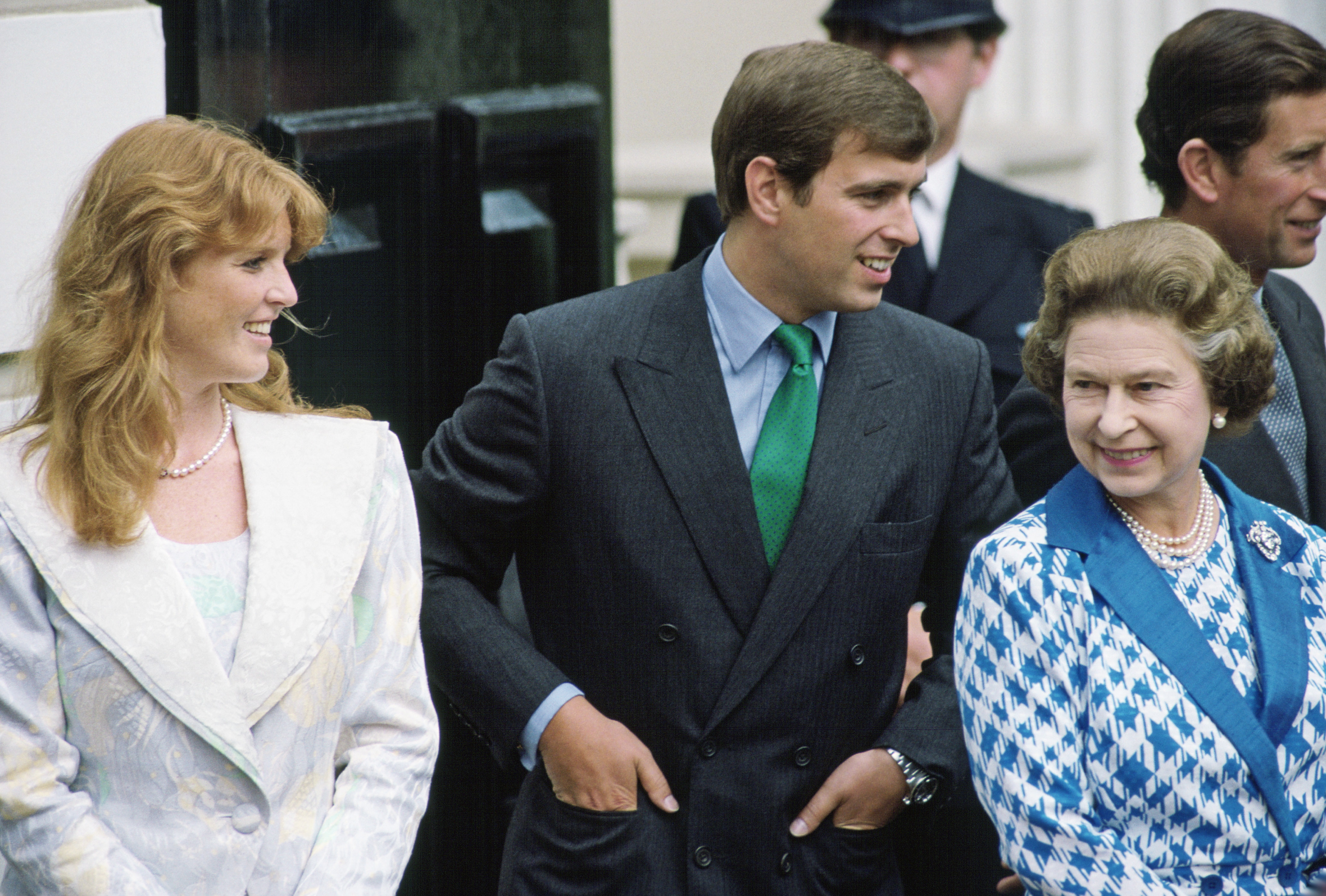 Sarah Ferguson, Prince Andrew and Queen Elizabeth wearing blazers and smiling