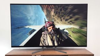 LG M3 OLED shown in living room playing a scene from Top Gun: Maverick