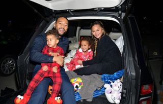 Miles Theodore Stephens, John Legend, Luna Simone Stephens, and Chrissy Teigen attend Netflix's "Jingle Jangle: A Christmas Journey" drive-in premiere at The Grove