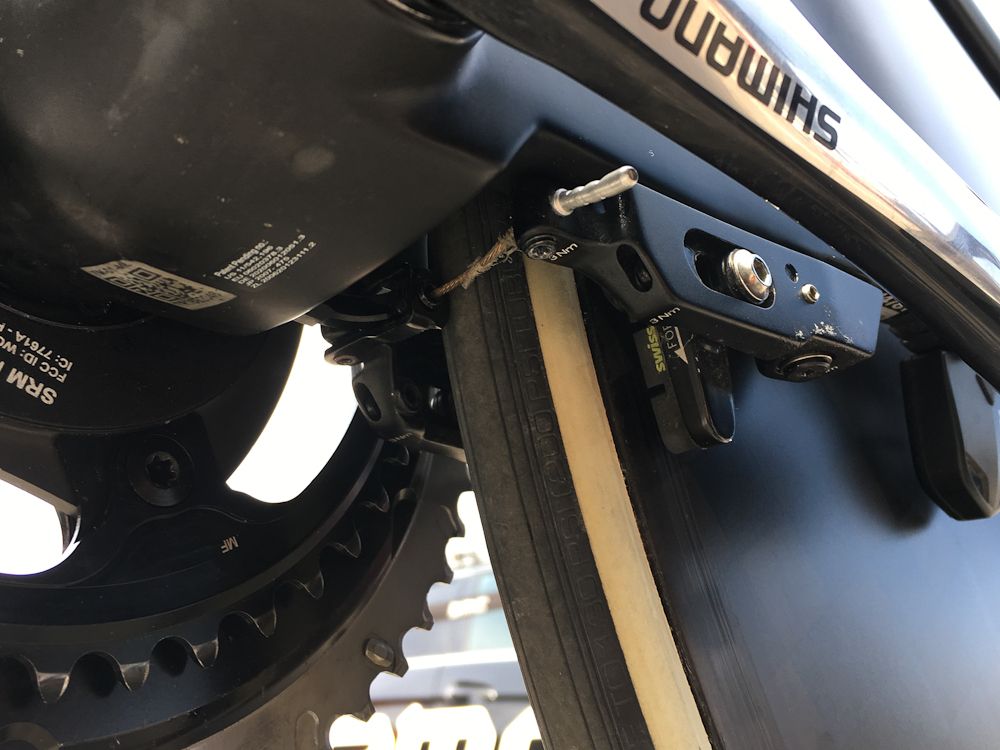 The rear brake is located underneath the chain stays