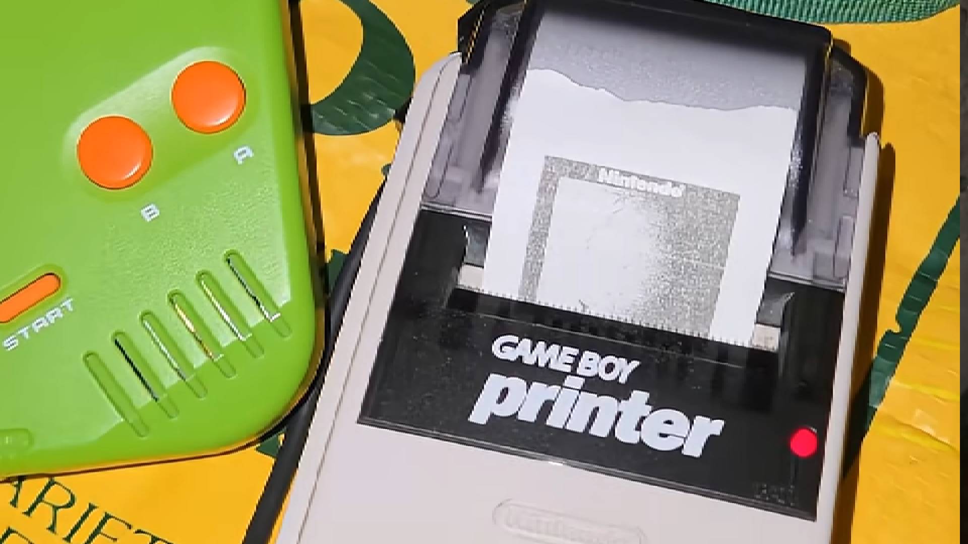 Close up of Game Boy Printer printing photo of Jupiter.